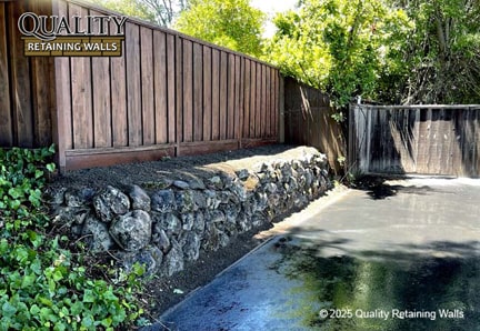 Finished boulder retaining wall built for hillside support in Northgate/Walnut Acres area, Walnut Creek, CA