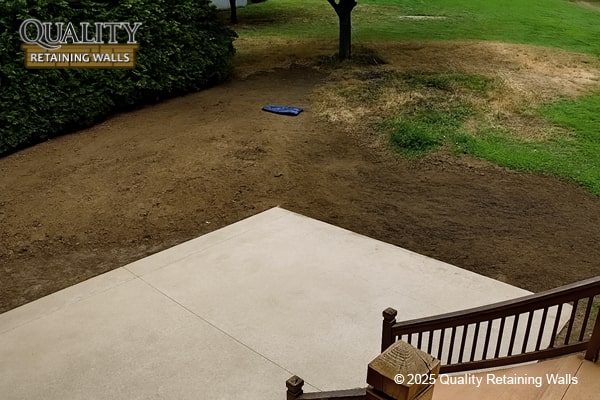 Uneven backyard terrain before custom retaining wall project in Walnut Heights area, Walnut Creek, CA