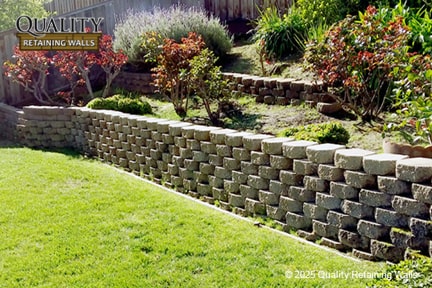 Multi-tiered concrete block retaining wall built for a San Ramon sloped backyard, creating usable yard space and level lawn area